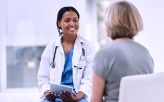 A health care provider speaks with a patient. 