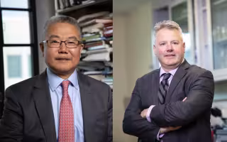 Side-by-side portraits of two men with short gray hair wearing suit jackets. One stands in front of full bookshelves and the other stands, arms folded, in a laboratory.