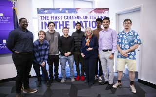 Sen. Gillibrand poses with students at Friday's press conference.