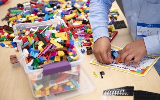 A child participates in the CEHC Lego Challenge at ETEC.