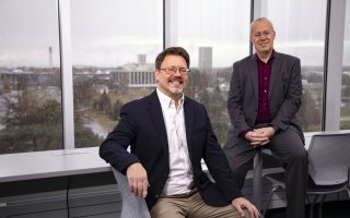 Eric Stern and Chris Thorncroft sit in ETEC's weather observation deck on a rainy day.