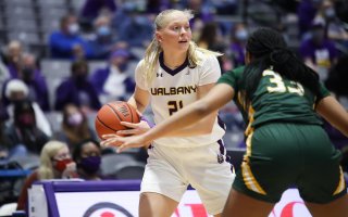 UAlbany women's basketball player Helene Haegerstrand on court against Vermont.