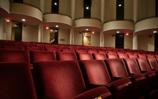 Rows of red velvet theatre seats are pictured inside the UAlbany Performing Arts Center.