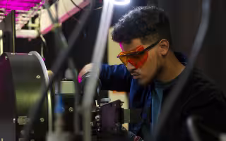 UAlbany Senior Kevin Reyes works in a lab at NYCREATES' Albany NanoTech complex.