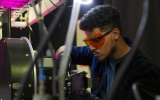 UAlbany Senior Kevin Reyes works in a lab at NYCREATES' Albany NanoTech complex.