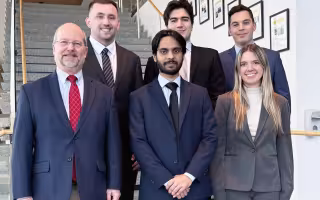 From left, Professor and Chair of Finance David Smith, Kevin Holder, Ashar Zahid, Tyler Rico, team leader Nohl Schwandtner and Sophia Hofer.