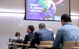 WISER attendees gather at a planning workshop inside ETEC.