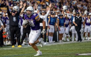 Griffin Woodell, a sophomore running back on the UAlbany football team, heads to the endzone for a touchdown on a long run.