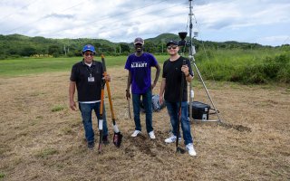 UAlbany researchers stand in front of a specialized sensor installed to monitor Puerto Rico's power grid.