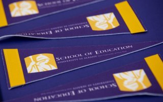 School of Education flags at Commencement 