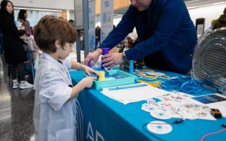 A young student show conducts an experiment inside of the ETEC research and development complex.