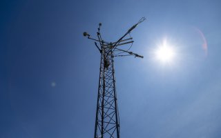 The sun shines over the New York State Mesonet station at Indian Ladder Farms in Voorheesville.