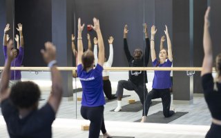 A group of students participate in a wellness class