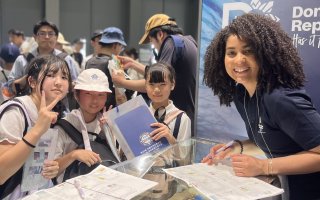 Sota Kojima stands with children at Expo 2025 Osaka-Kansai.
