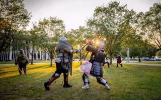 Living History Club members and off-campus advisor Avery Prokopowicz fight and practice combat techniques in leather and steel armor.