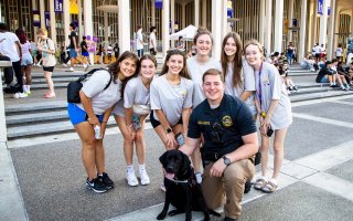 Roxy and UPD Officer Faath attend Convocation festivities to start the 2023 fall semester.