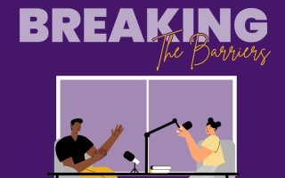 Illustration of two people at a table, talking into microphones. Purple background with words "Breaking the Barriers"