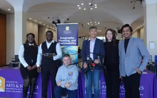 Faculty and students take a photo together at UAlbany's GIS Day celebration.