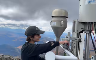 Sara Lombardo configures cloud water instrumentation from the top of Whiteface Mountain.