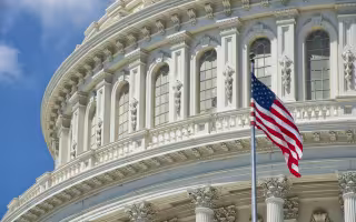 An American Flag waves outside U.S. Capitol Building 