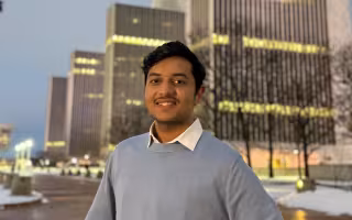 UUlbany graduate student Pallav Savaliya stands in front of the Empire State Plaza.