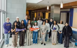 Group of students and faculty stand with Saxbys staff to celebrate the new student-led cafe coming in the fall