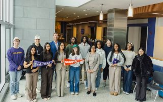 Group of students and faculty stand with Saxbys staff to celebrate the new student-led cafe coming in the fall