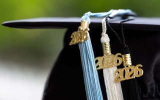 Photo of a graduate's cap with 2026 tassels