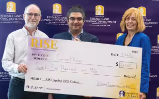 Members of CurrentView, led by CNSE's Omid Rajabi Shishvan, celebrate after winning top prize during the spring RISE Demo Day competition. (Photo by University Photo Service)