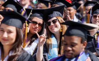a croud of graduates wearing mortarboards