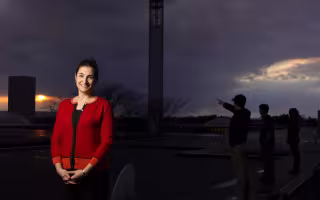 Kristen Corbosiero stands on the roof overlooking the academic podium.
