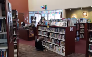 A child looks at books inside the Kids' Zone at Ignacio Public Library on the Southern Ute Indian Tribe Reservation in Colorado.