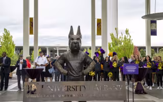 The new Damien statute and bench stand tall on the Academic Podium.