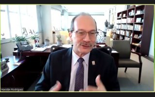 A screenshot of President Rodríguez speaking during a Zoom meeting