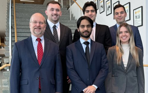 From left, Professor and Chair of Finance David Smith, Kevin Holder, Ashar Zahid, Tyler Rico, team leader Nohl Schwandtner and Sophia Hofer.