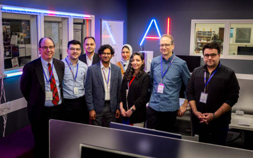 Information Science PhD Students with Keynote Speaker Jonathan Rochelle, Professor Abdullah Canbaz and Malcolm McPherson, member of the FIRST Board in the AI in Complex Systems Lab (Photo by Brian Busher)
