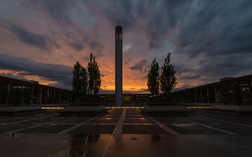 UAlbany's Academic Podium at sunset, with the carillon stark against a moody evening sky.