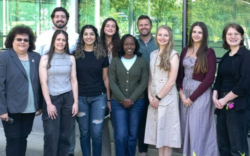 PhD Candidate Naa Adade along with group of students and administrators.