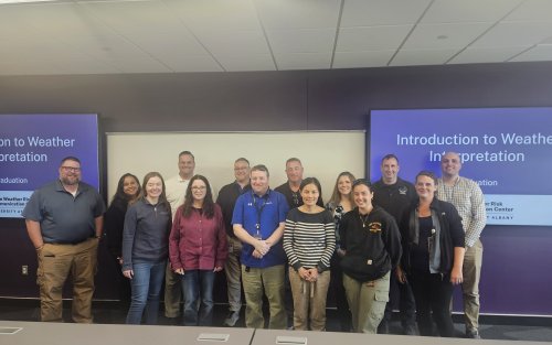 Graduates of the State Weather Risk Communication Center microcredential pose for a class photo.