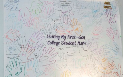 Poster of handprints left by first-gen students