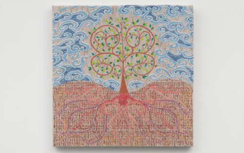 An abstract piece of a tree with its roots visible in the soil.