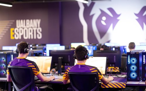 Students play PC games from inside the UAlbany Esports arena.