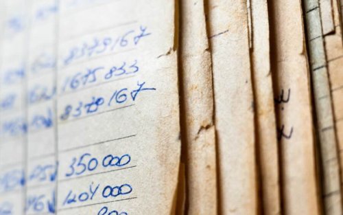 Archived papers stacked together. 