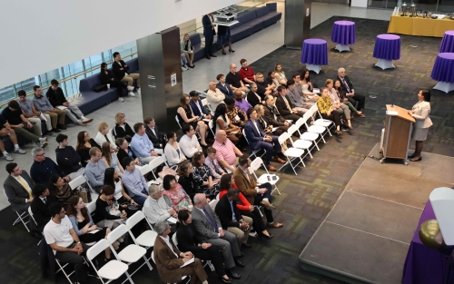 Dean Paquita Davis-Friday speaks to an audience of students and loved ones during the third annual Graduating Student Achievement Awards.