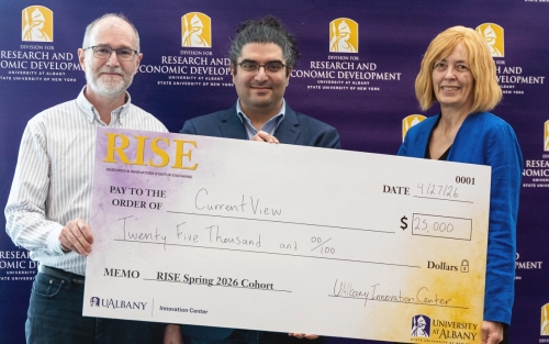 Members of CurrentView, led by CNSE's Omid Rajabi Shishvan, celebrate after winning top prize during the spring RISE Demo Day competition. (Photo by University Photo Service)