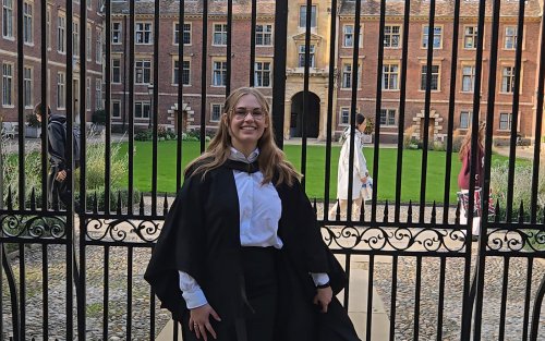 Kate Bucek of UAlbany stands in front of Cambridge University after receiving her graduate degree.