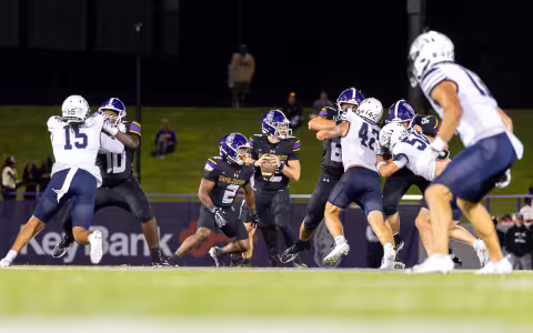 UAlbany QB Kai Colón lines up for a pass at Bob Ford Field.