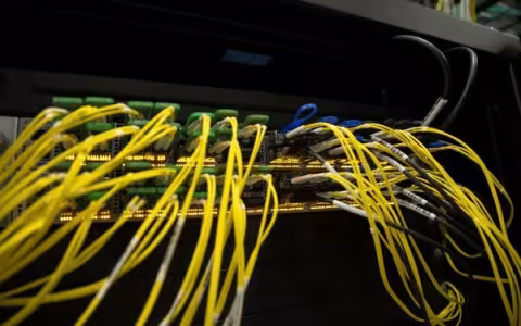 Dozens of cables connecting into a server at a data center.