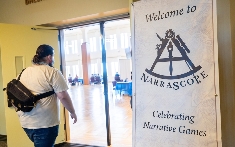 An attendee of NarraScope 2026 walks into the Campus Ballroom.