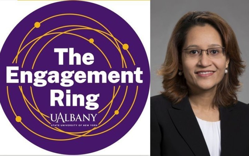 round purple logo reading "The Engagement Ring UAlbany" next to a headshot of a woman in glasses and a black jacket